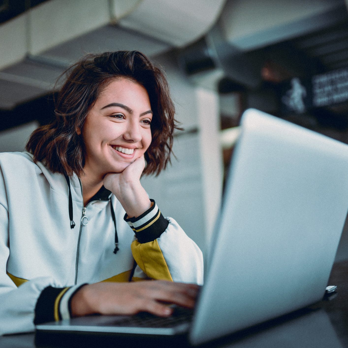 A shopper paying on a laptop